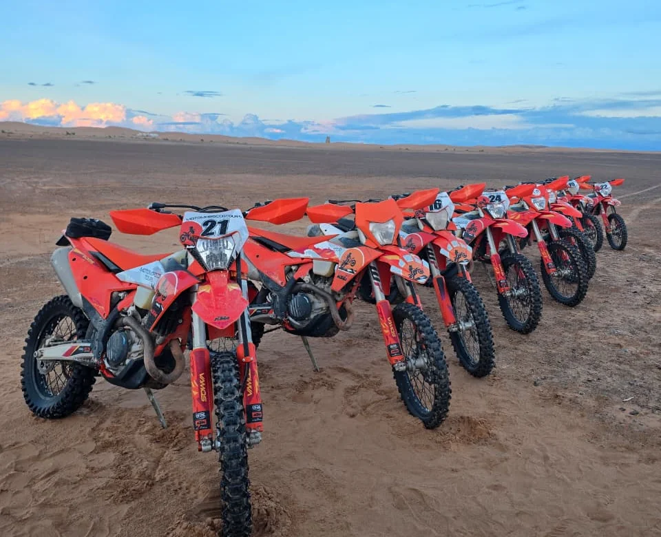 Line of KTM motorcycles on the desert route near Merzouga
